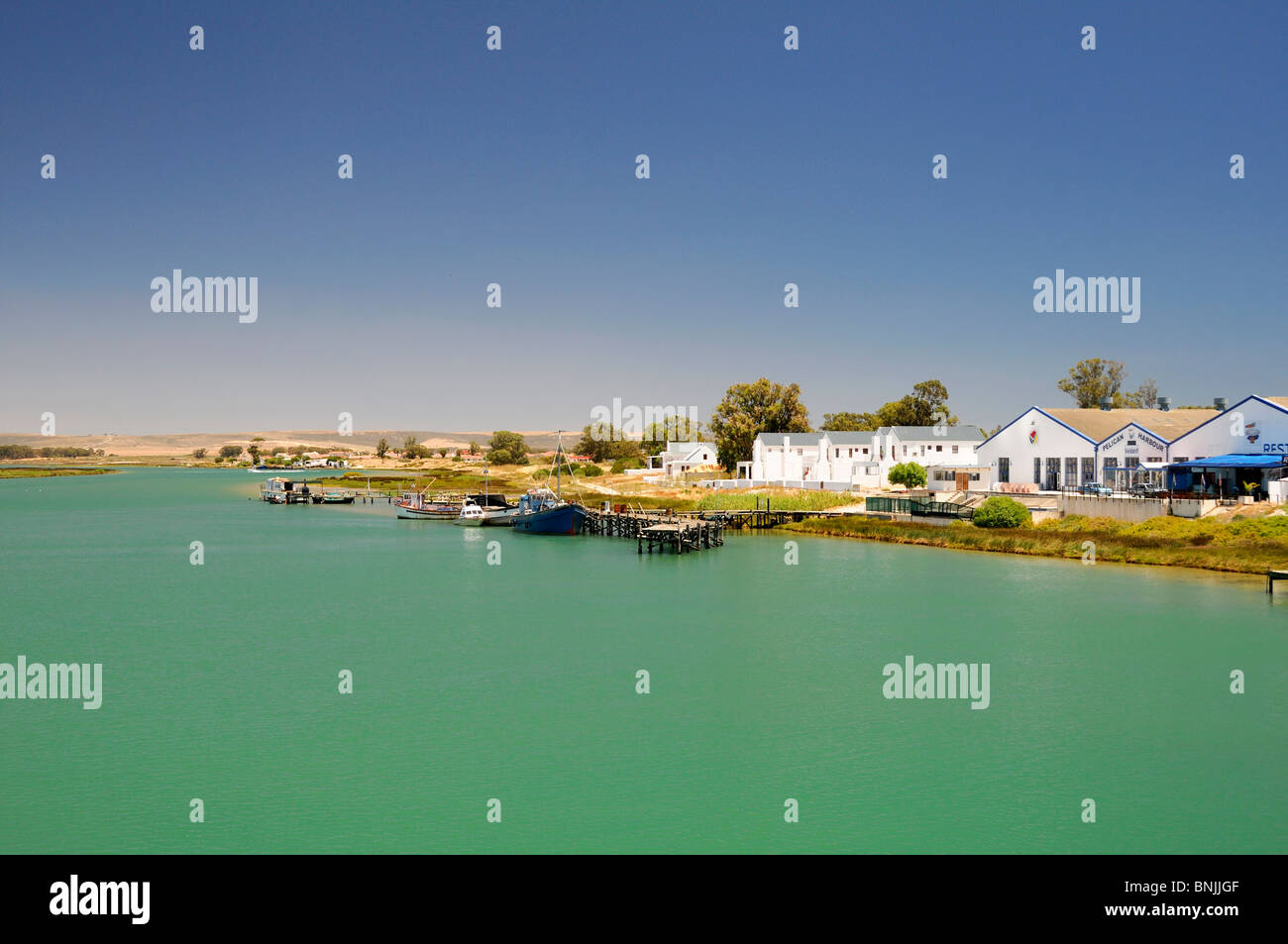view from Bridge inlet at Velddrif Western Cape South Africa landscape water houses coast boats Stock Photo