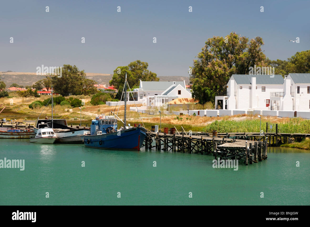view from Bridge inlet at Velddrif Western Cape South Africa landscape water houses coast boats Stock Photo