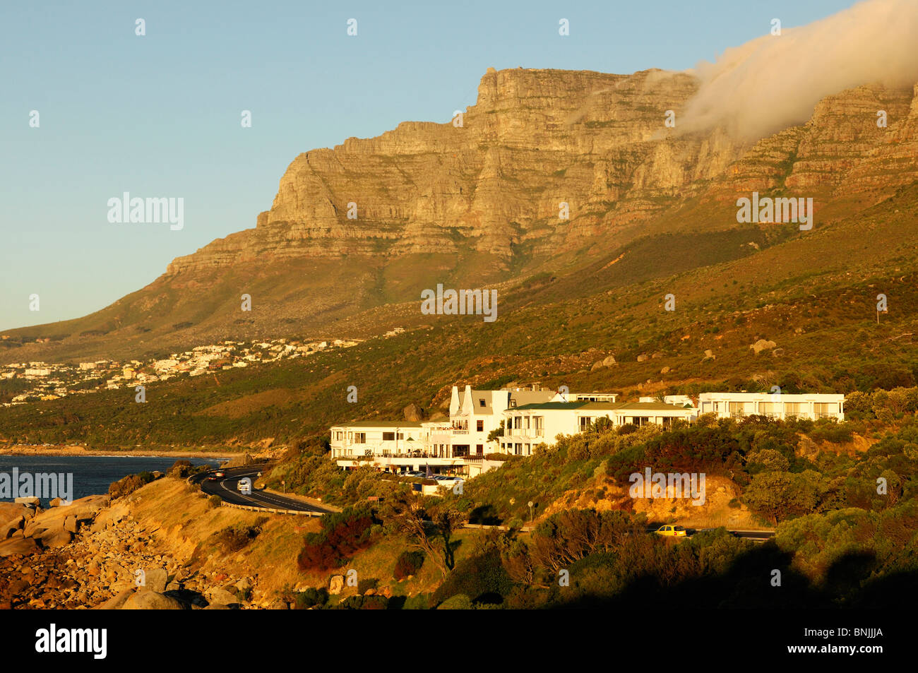 Twelve Apostles Hotel Camps Bay Cape Peninsula Western Cape South Africa coast ocean sea shore scenery mountain mountains Stock Photo