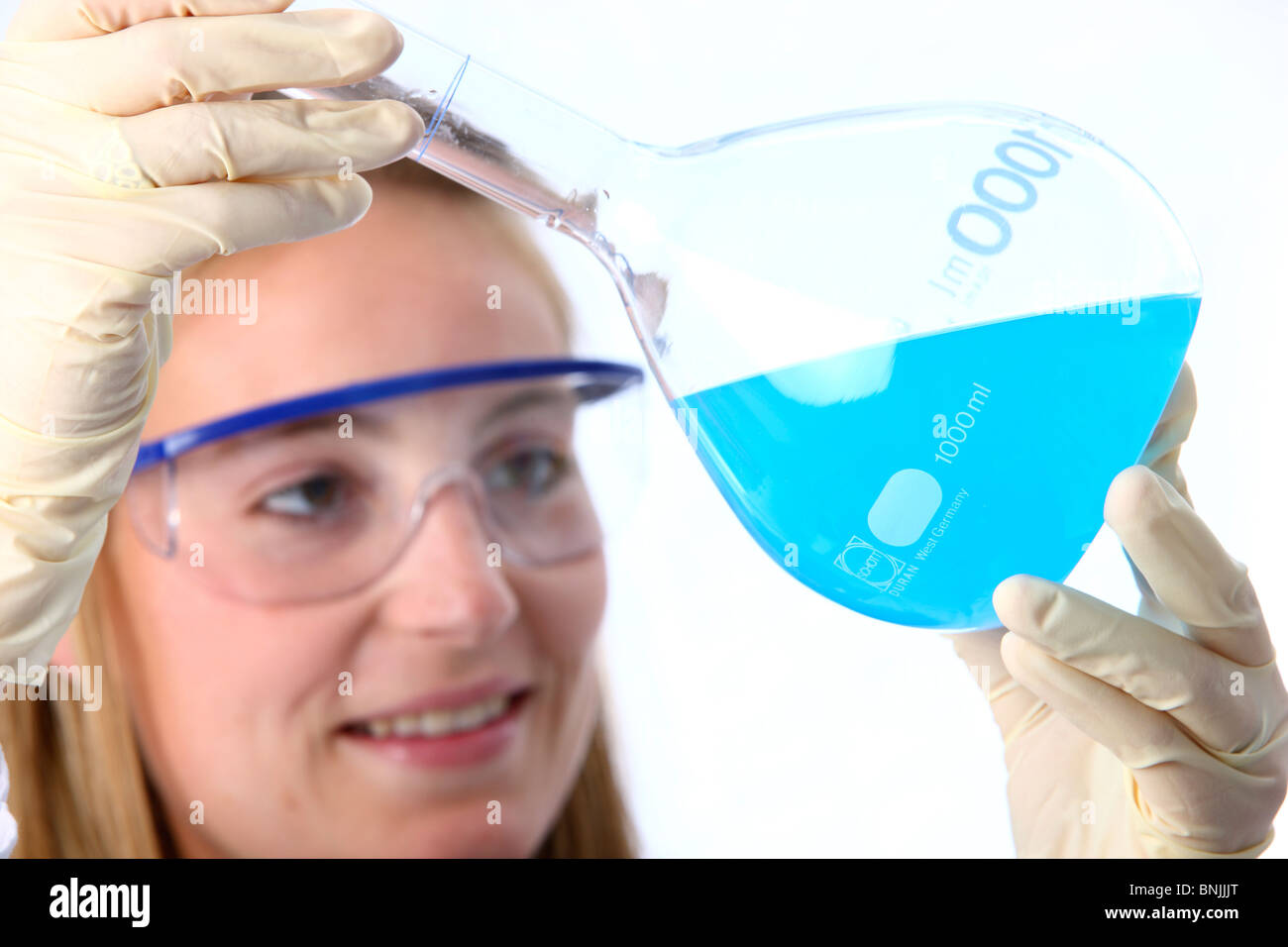 Laboratory assistant working in a chemical laboratory. Working with different chemicals in test