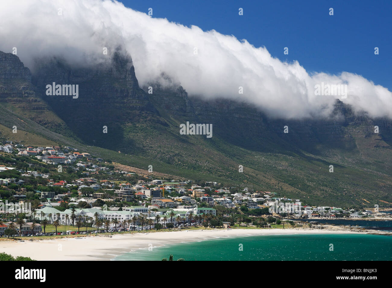 Twelve Apostles Mountains Camps Bay Cape Peninsula Western Cape South Africa fog clouds shore coast sea ocean houses scenery Stock Photo