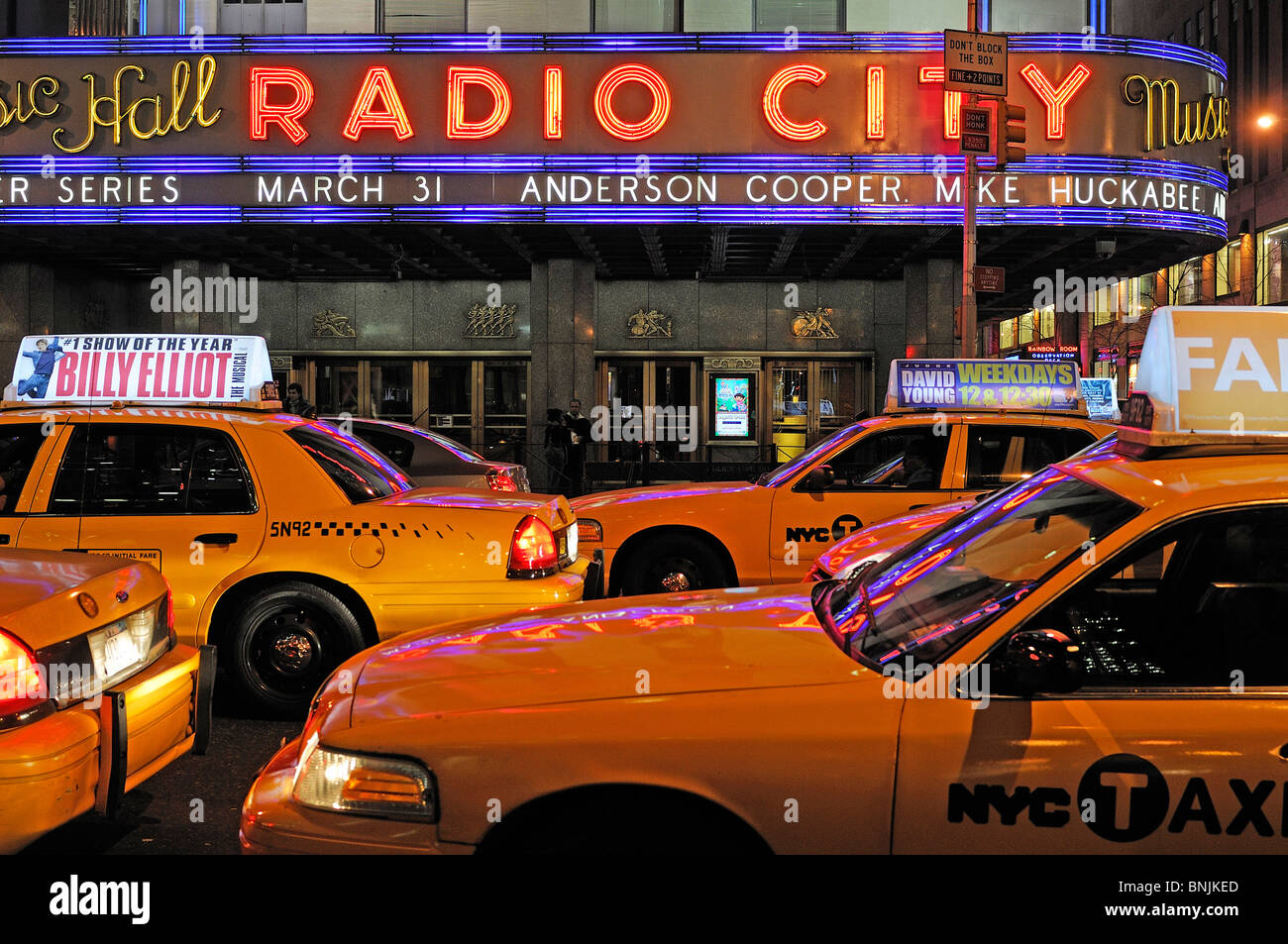 Radio City Music Hall Midtown Manhattan New York USA taxi cab yellow city travel american urban Stock Photo