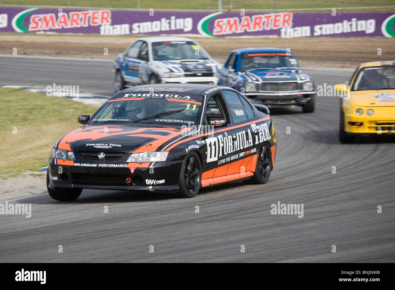 Holden Commodore leading at an Australian car race meeting. Barbagallo