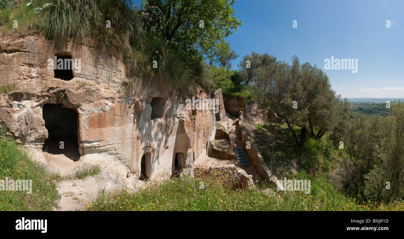 Grotto di Zungri Calabria Mediterranean Italy vegetation trees rocks cliffs cliff apartments cave houses Stock Photo
