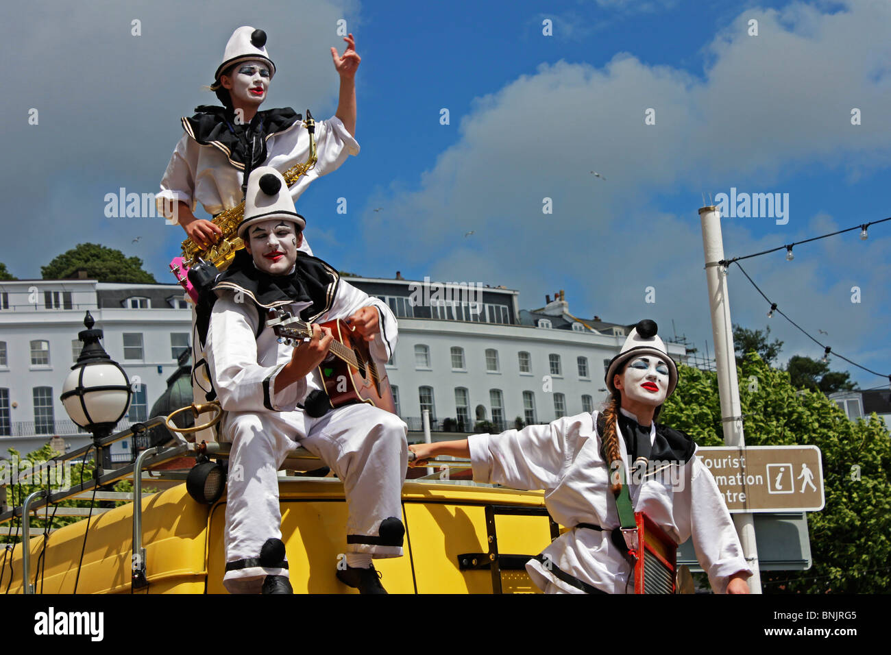 Pierrot Troupe of entertainers the Pier Echoes perform music song and dance on the Torbay sea front at Torquay Stock Photo