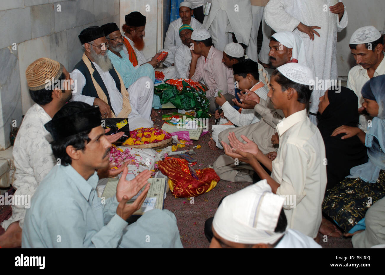 Muslims perform religious rites during Urs at Dargah. Stock Photo