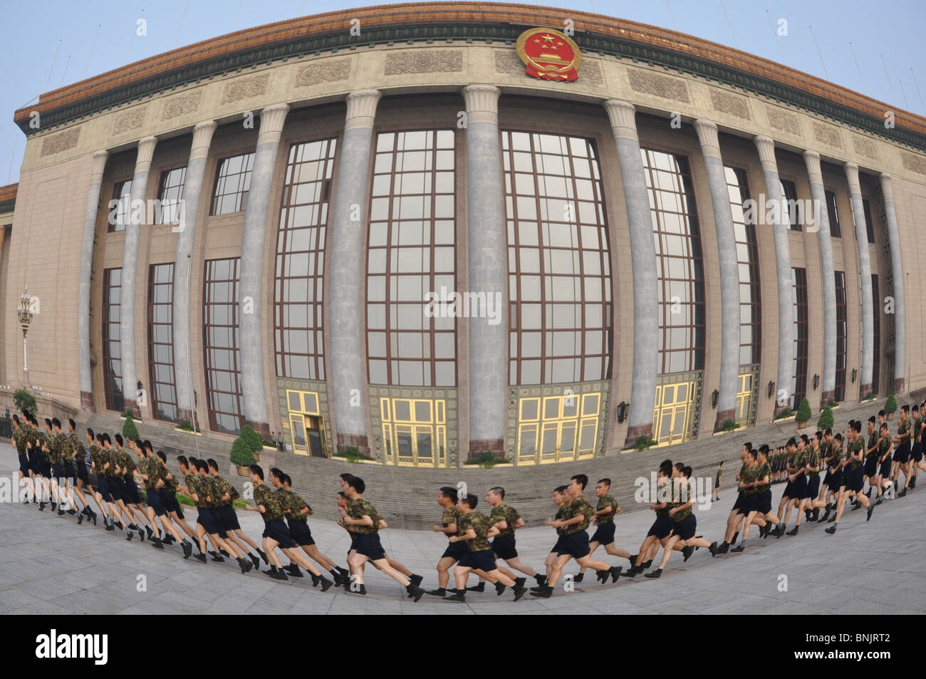Chinese soldiers do early morning physical PT exercises in Tiananmen Square, Beijing, China Stock Photo