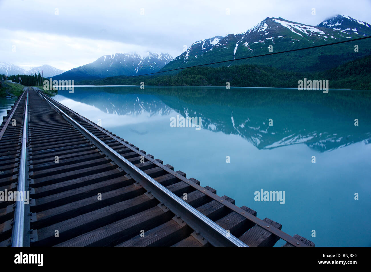 Vagt lake Railroad Tracks and Mountains of the Chugach National Forest Alaska Stock Photo