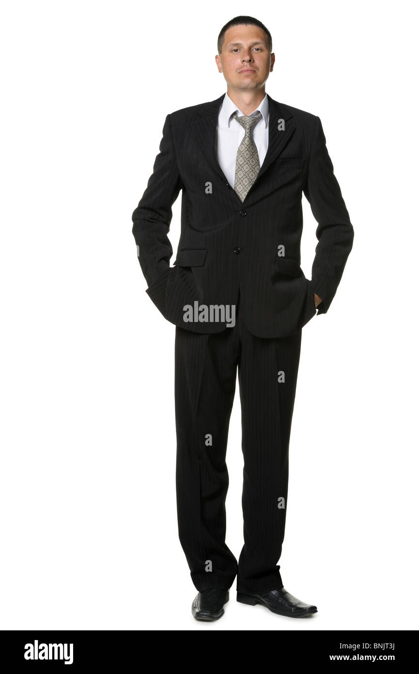 The businessman in a black suit. It is isolated on a white background ...