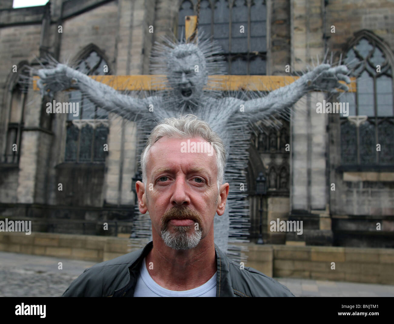 David Mach, the Scottish artist and sculptor stands in front of his latest coat hanger sculpture in Edinburgh, July 2010. Stock Photo