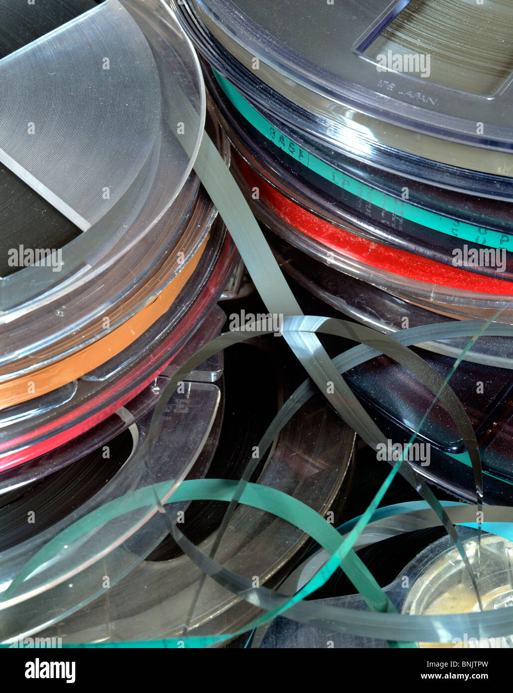 Old-fashioned technology: a pile of reel-to-reel audio tapes Stock Photo