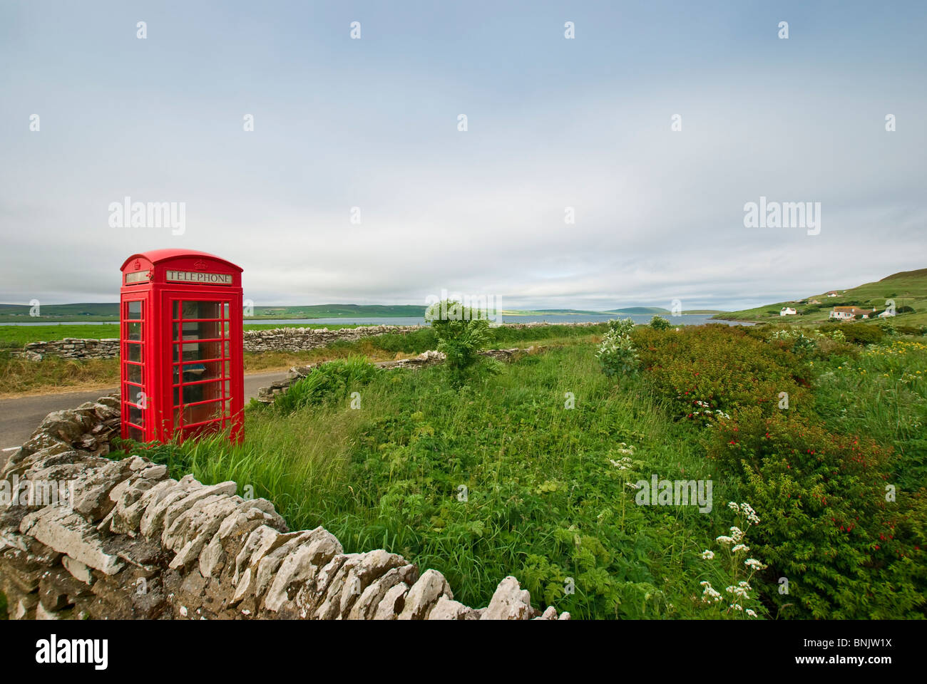 A typical British red telephone booth on the small isle of Rousay, Orkney. Stock Photo