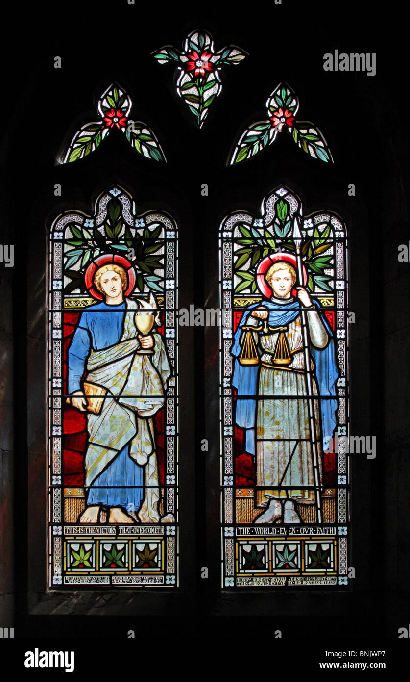 A stained glass window by Henry E. Wooldridge depicting Saint John the Evangelist and Saint Michael, Church of St Laurence, Lighthorne, Warwickshire Stock Photo
