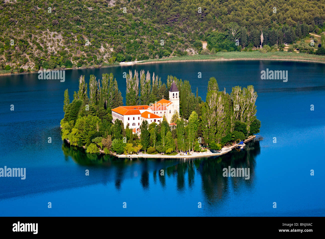 A small island with a Christian monastery on river Krka, Croatia - Europe. Stock Photo