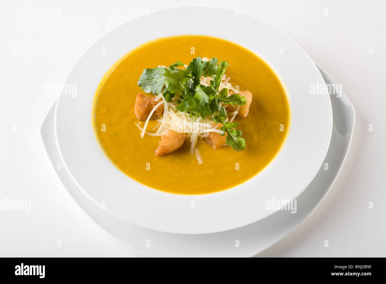 Pumpkin soup served with croutons and parmesan cheese Stock Photo - Alamy