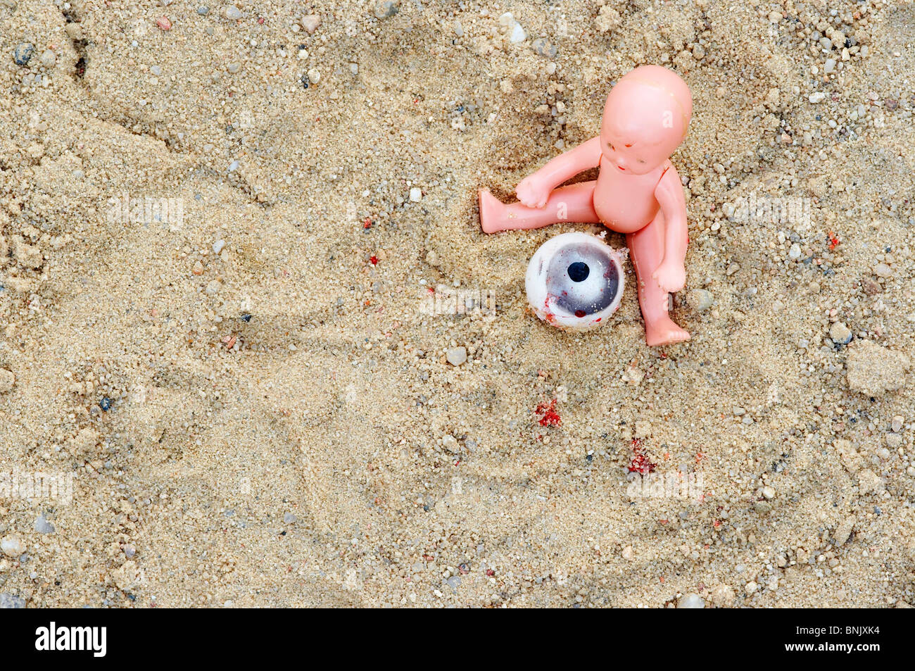 Surreal image - child on the sandpit Stock Photo