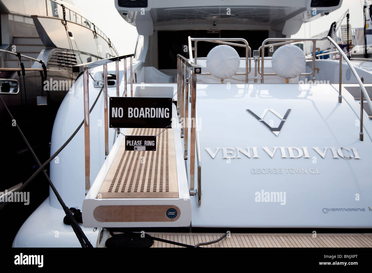 A luxury yacht moored up with with a no boarding notice moored in Cannes, France old port Stock Photo