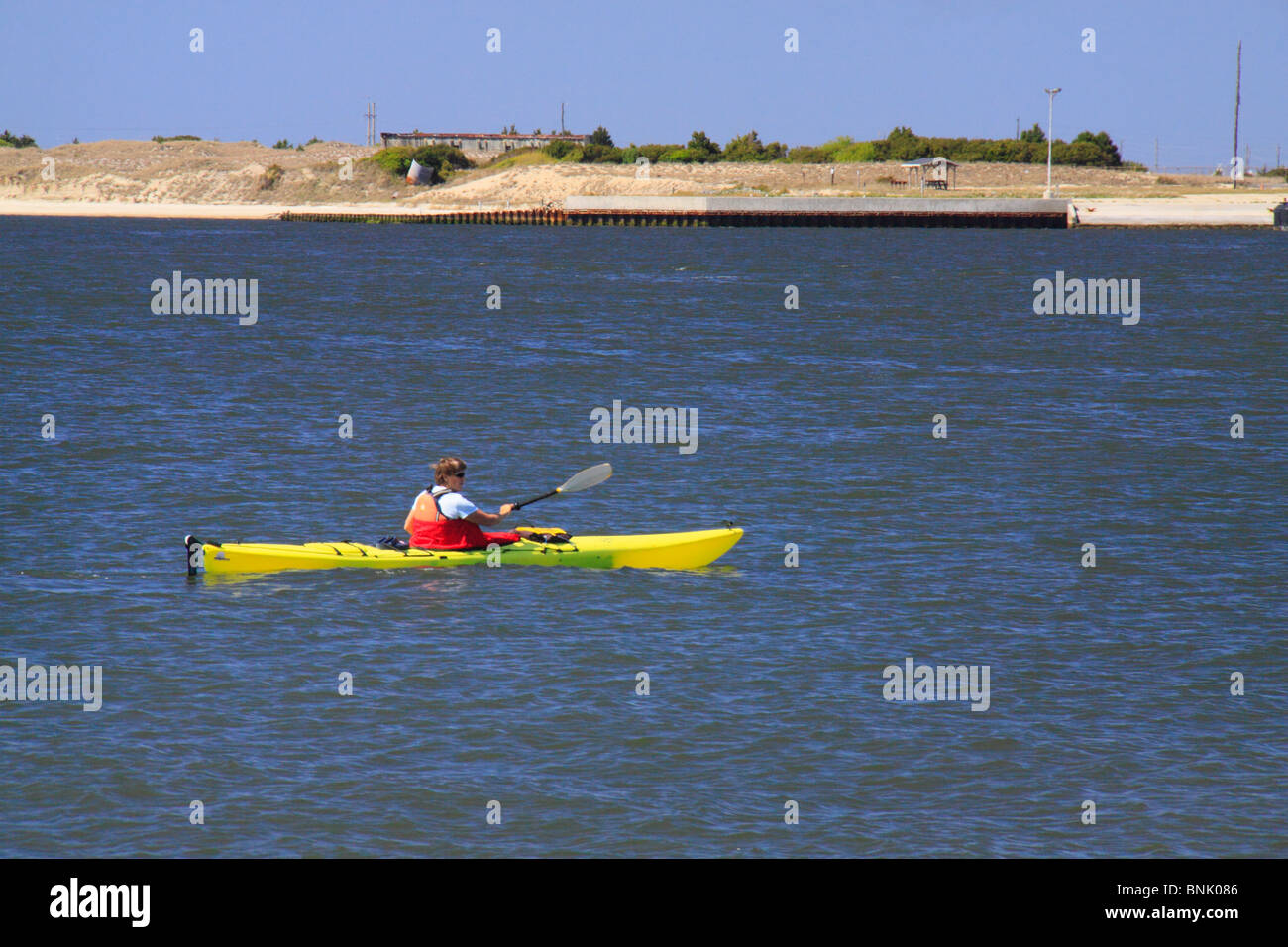 Kayaker in Beaufort Inlet at Fort Macon State Park, Atlantic Beach, North Carolina, USA Stock Photo