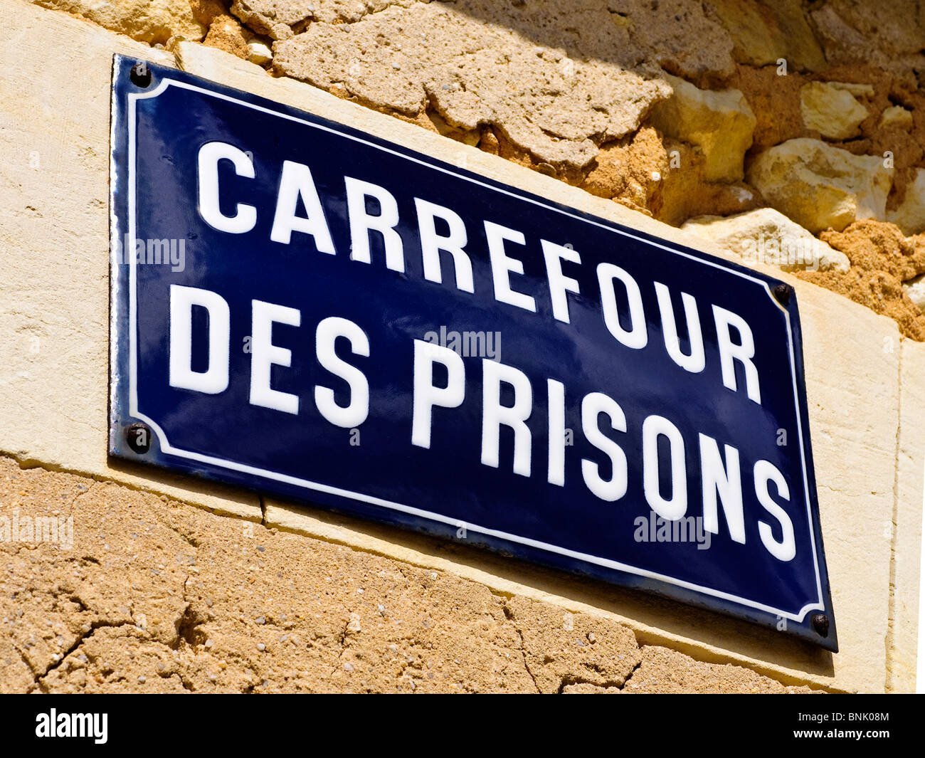 French blue enamel street sign 'Carrefour des Prisons' - France. Stock Photo