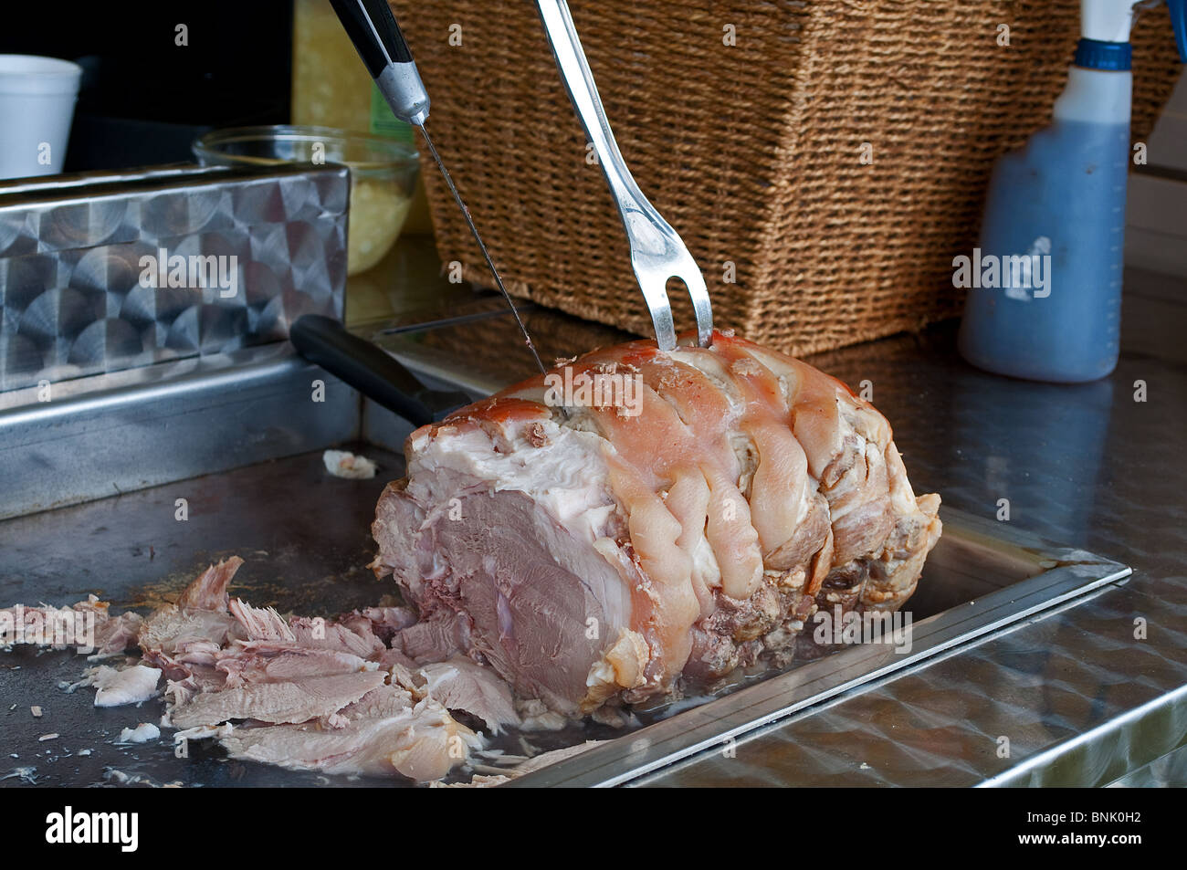 a pork joint being roasted at an outside catering outlet, uk Stock Photo