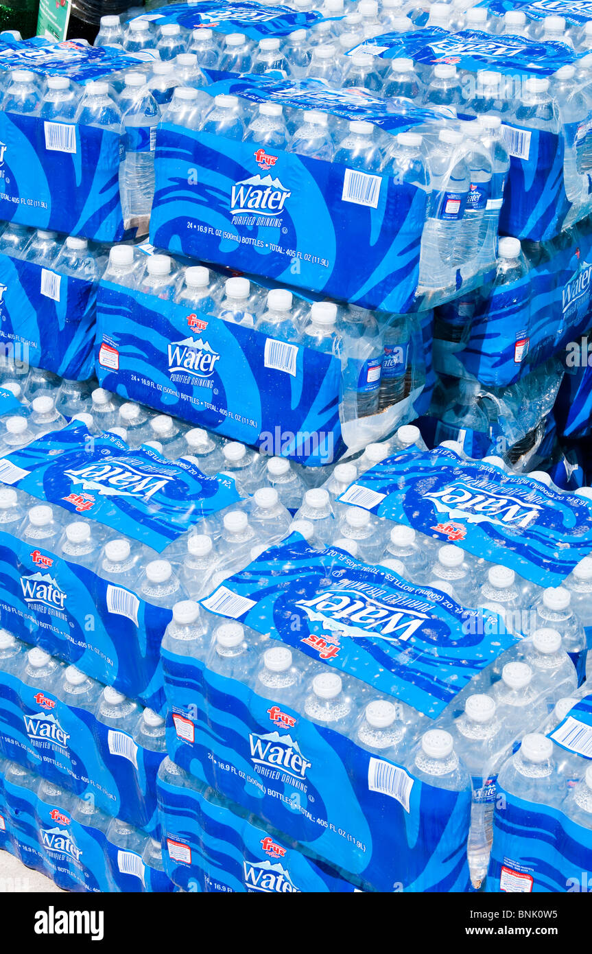 Wrapped packages of bottled drinking water for sale at a grocery store