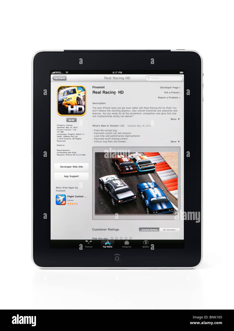 Apple iPad 3G tablet with a racing simulator video game in app store on its display isolated on white background with clipping Stock Photo