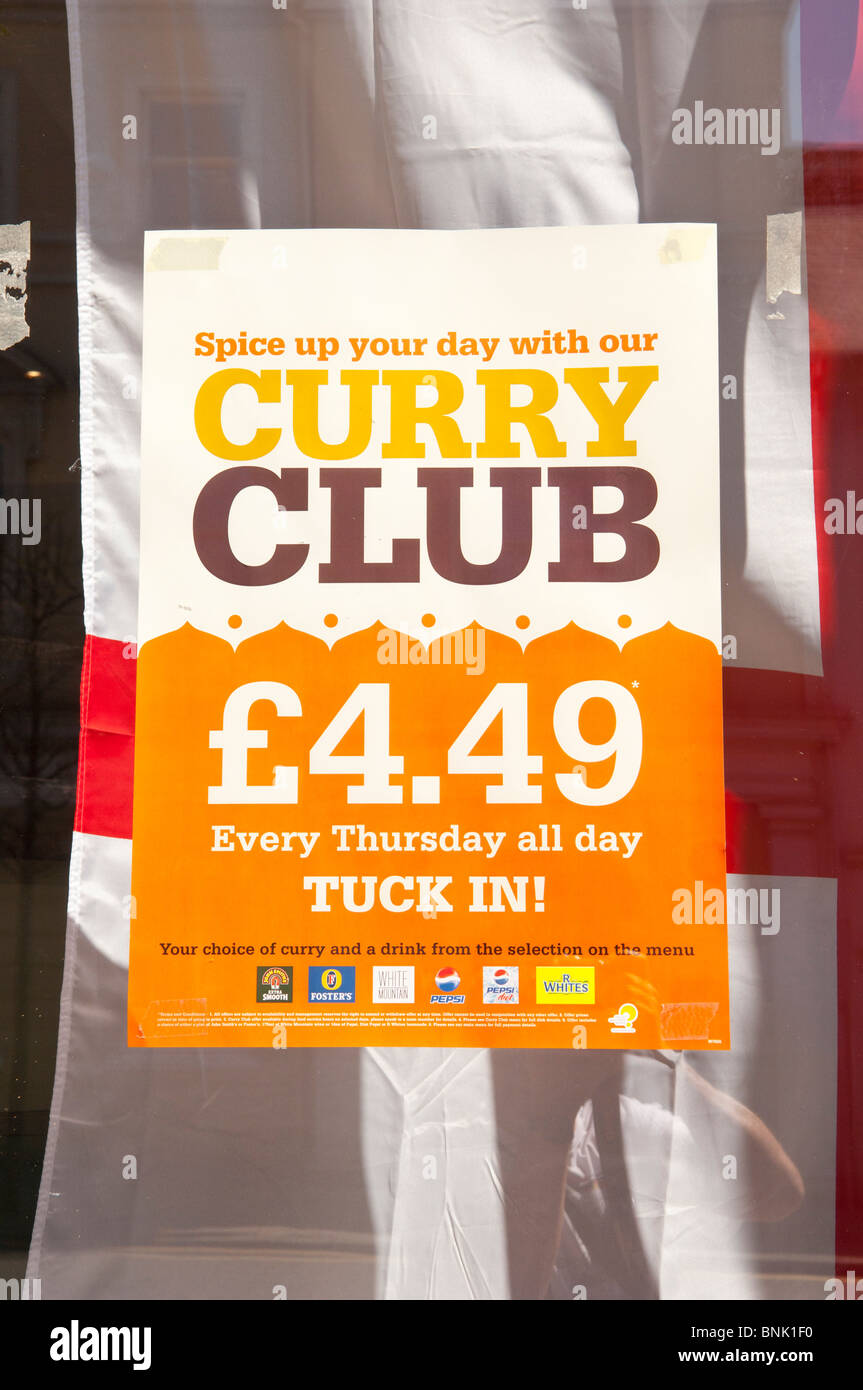 A sign promoting curry night in a pub in Norwich , Norfolk , England