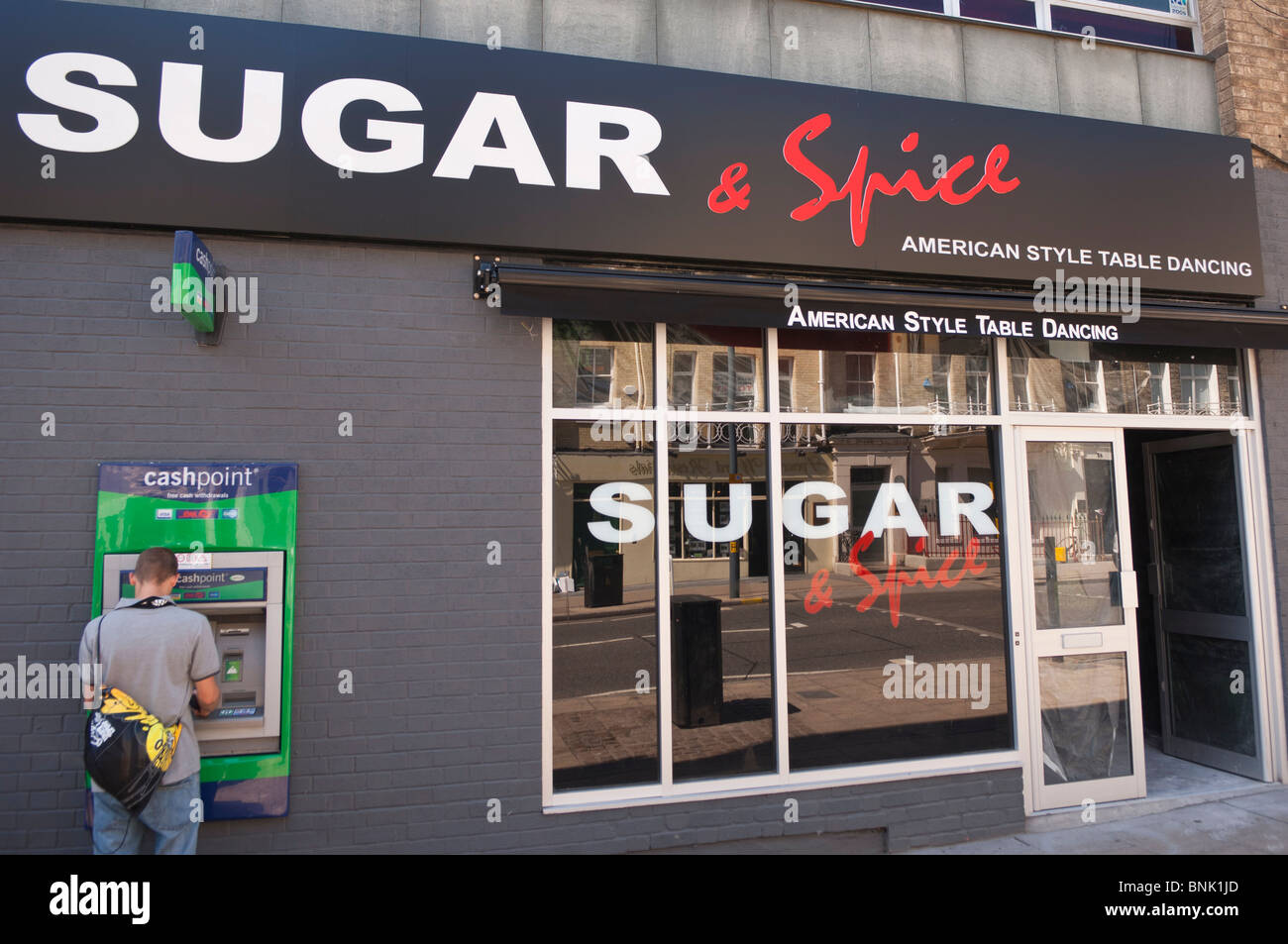 The sugar & spice club with table dancing and conveniently placed ATM in Norwich , Norfolk , England , Great Britain , Uk Stock Photo