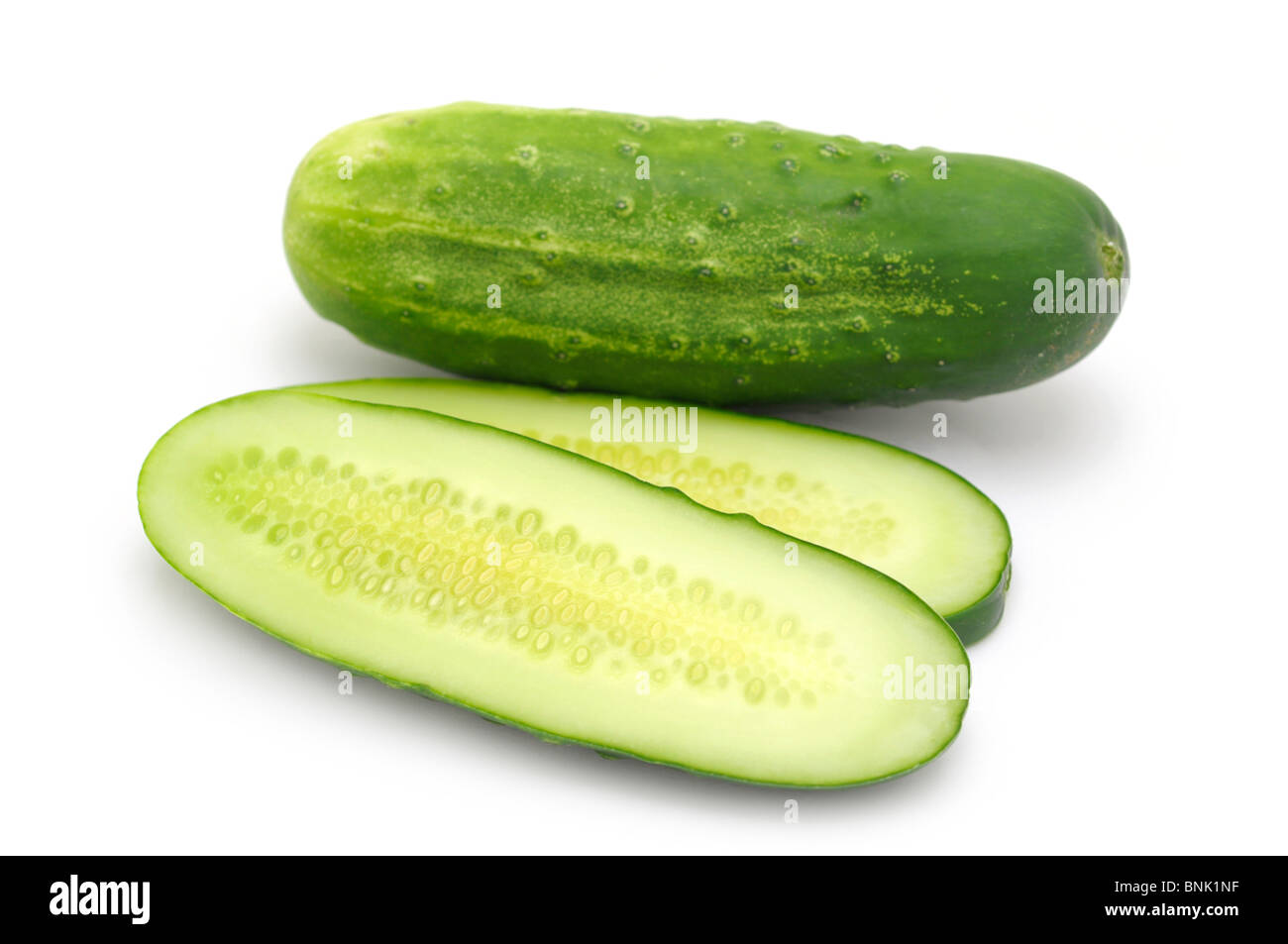 Whole and Sliced Cucumbers Stock Photo