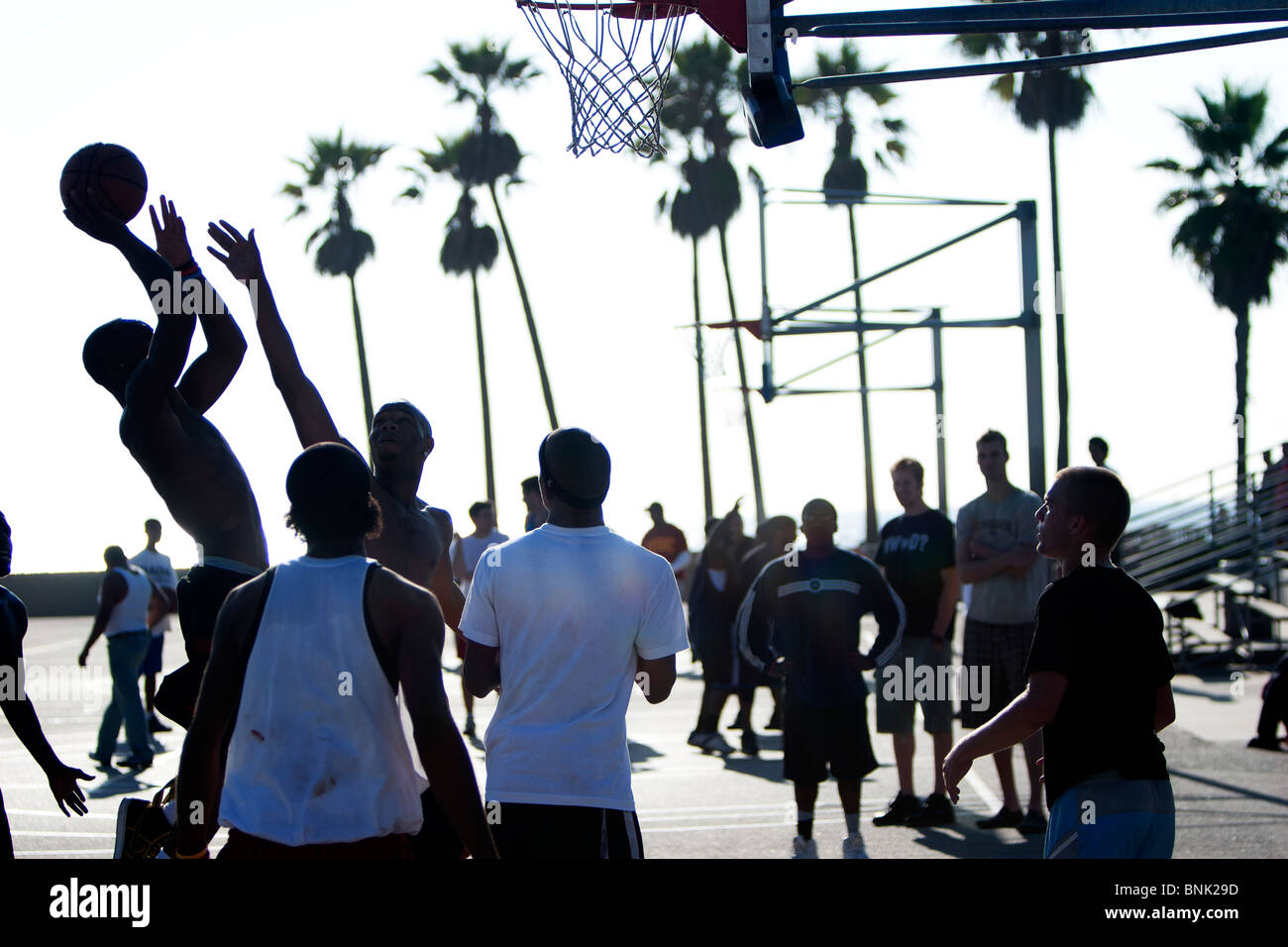 Guys playing street basketball at Venice Beach, Ca. Stock Photo
