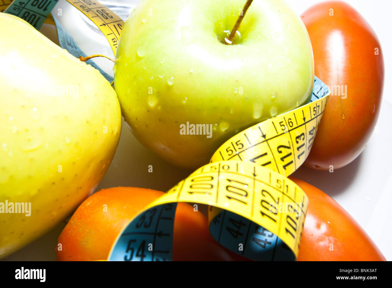 achievement aim appetising apple background calorie carbohydrates centimeter centimeters centimetres citrus close coil coiled co Stock Photo