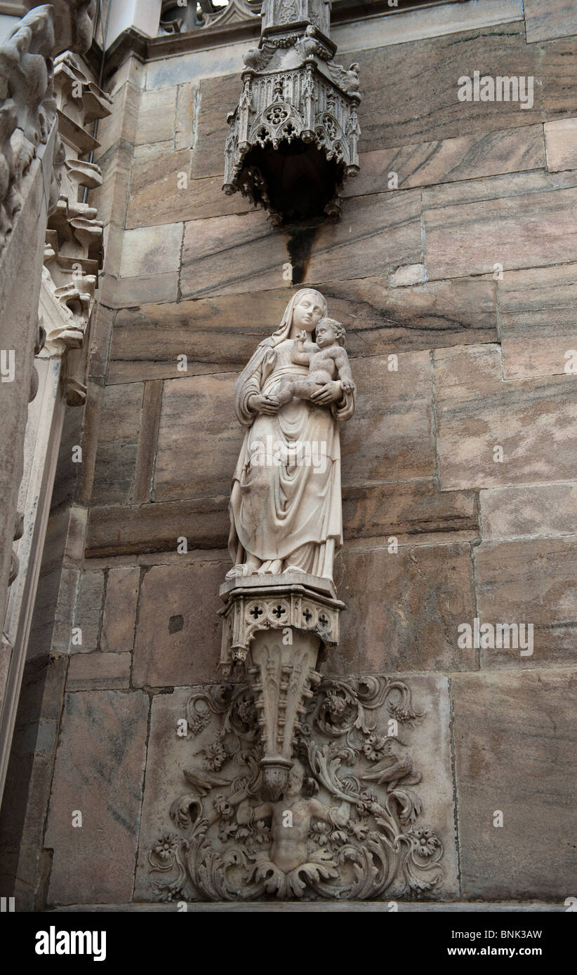 A Madonna with Baby Jesus statue on Milan Duomo Stock Photo