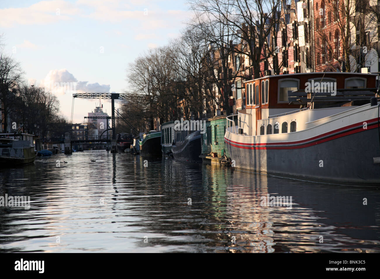Canal and house boats in Amsterdam Stock Photo