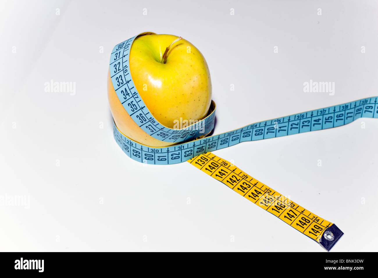 an apple with centimeter Stock Photo
