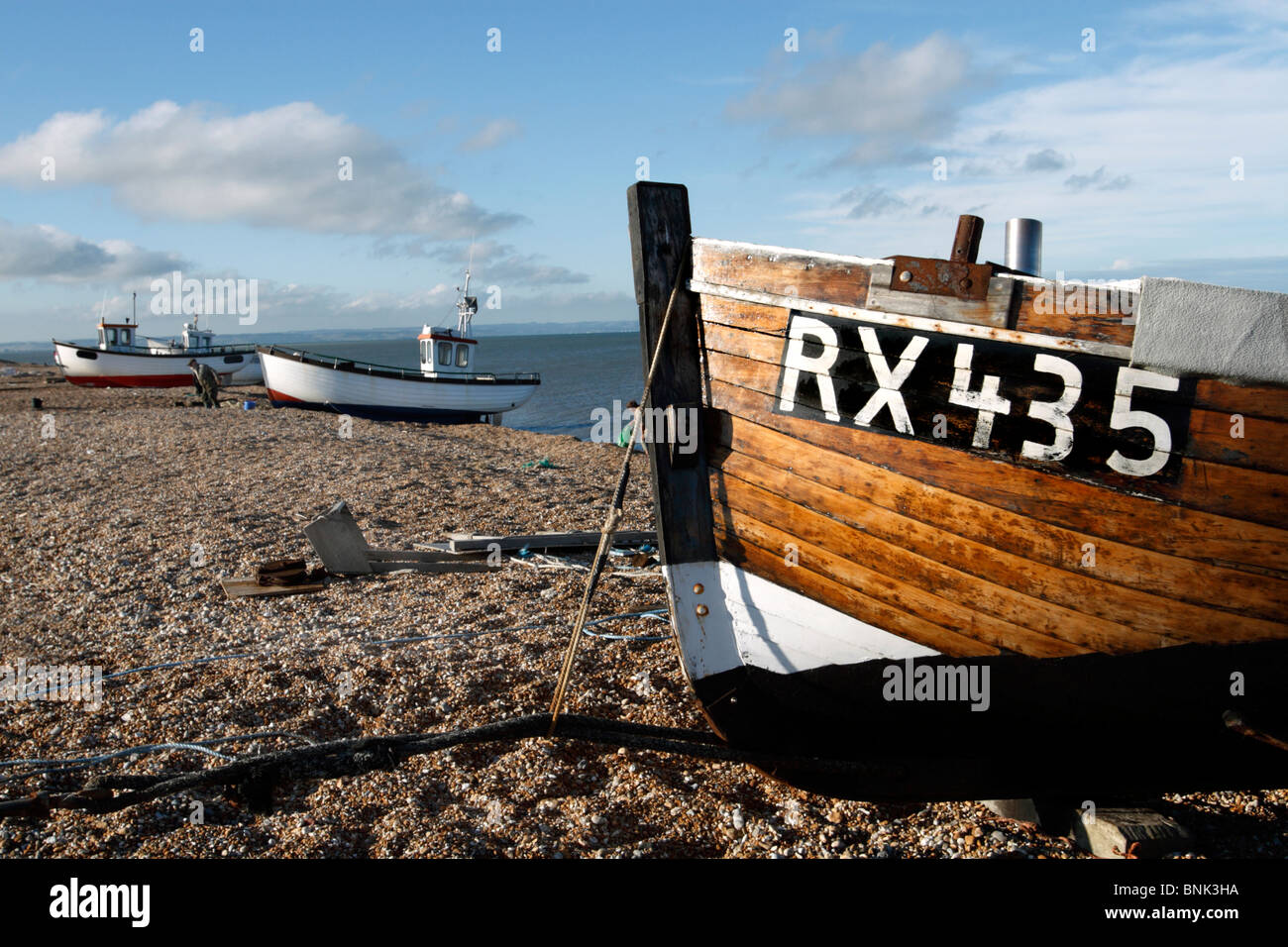 Fishing boats on shingle beach, Dungeness, Kent Stock Photo - Alamy