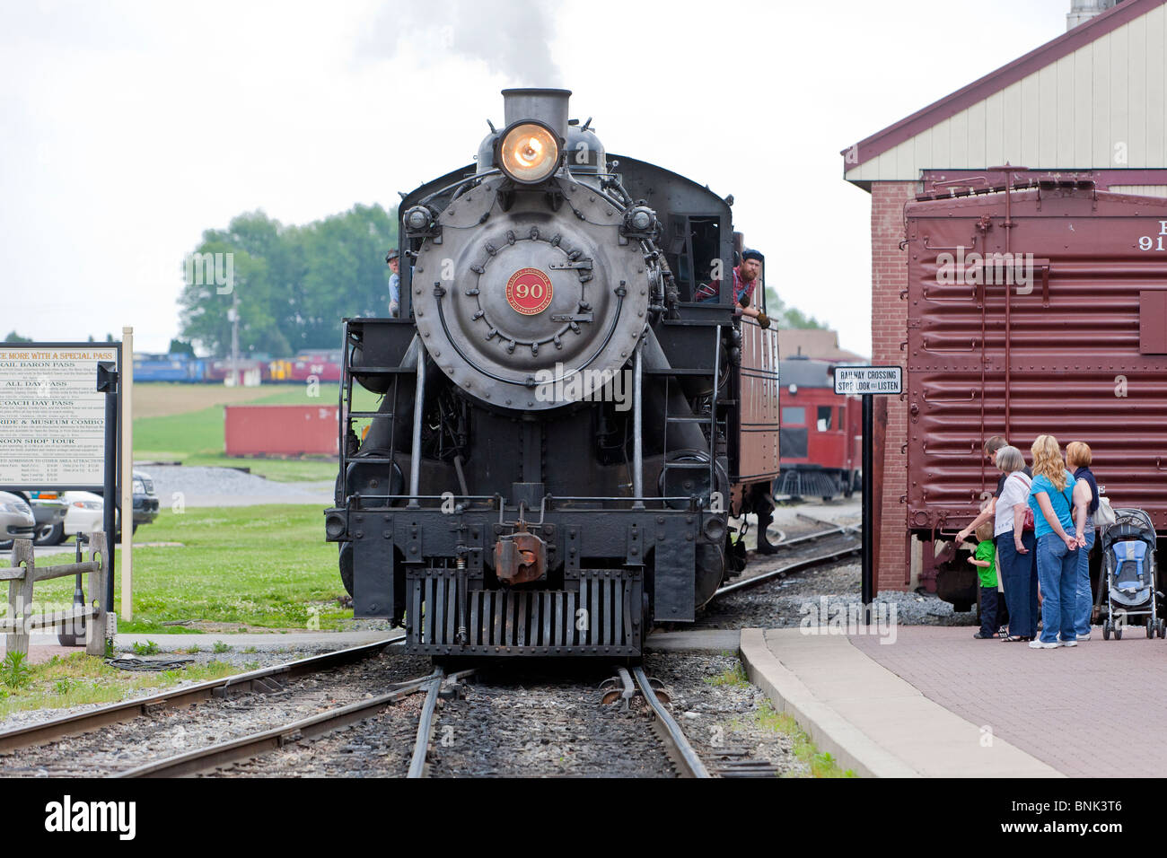 A Steam Train pulling into the train station Stock Photo Alamy