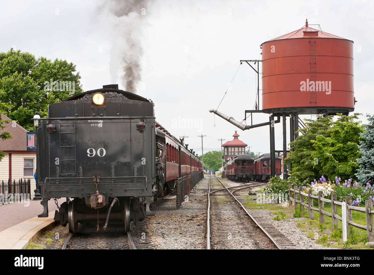 A Steam Train pulling into the train station Stock Photo Alamy