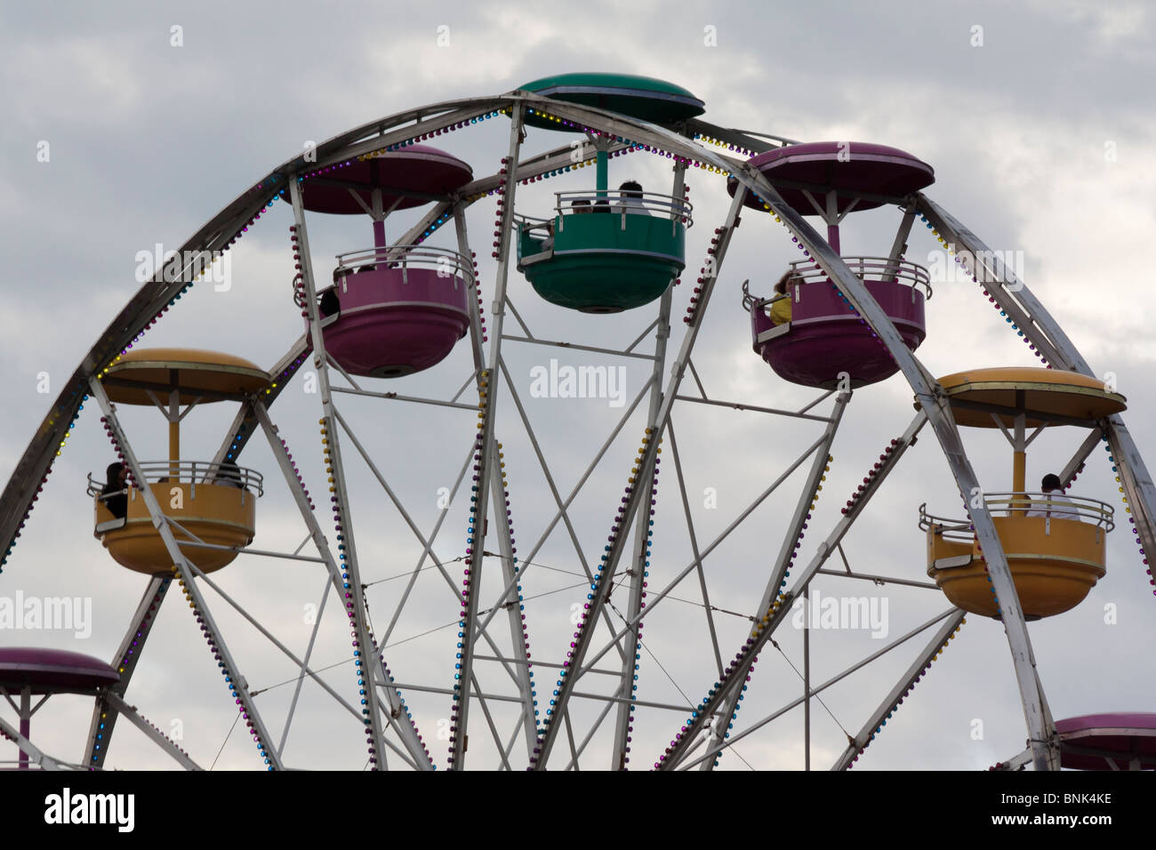 Close up of Ferris wheel with the people sky horizontal low angle from
