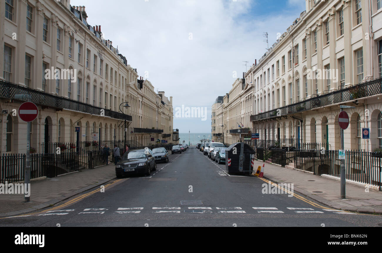 UNITED KINGDOM, ENGLAND, BRIGHTON - A street of houses leading to the seafront. Stock Photo