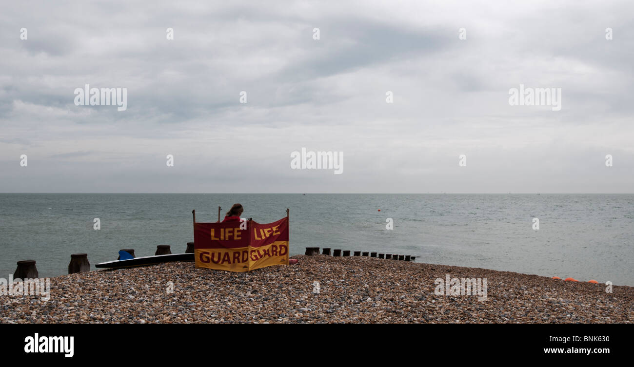 UNITED KINGDOM, ENGLAND, UK - A lifeguard on the beach at Eastbourne on the East Sussex coast. Stock Photo
