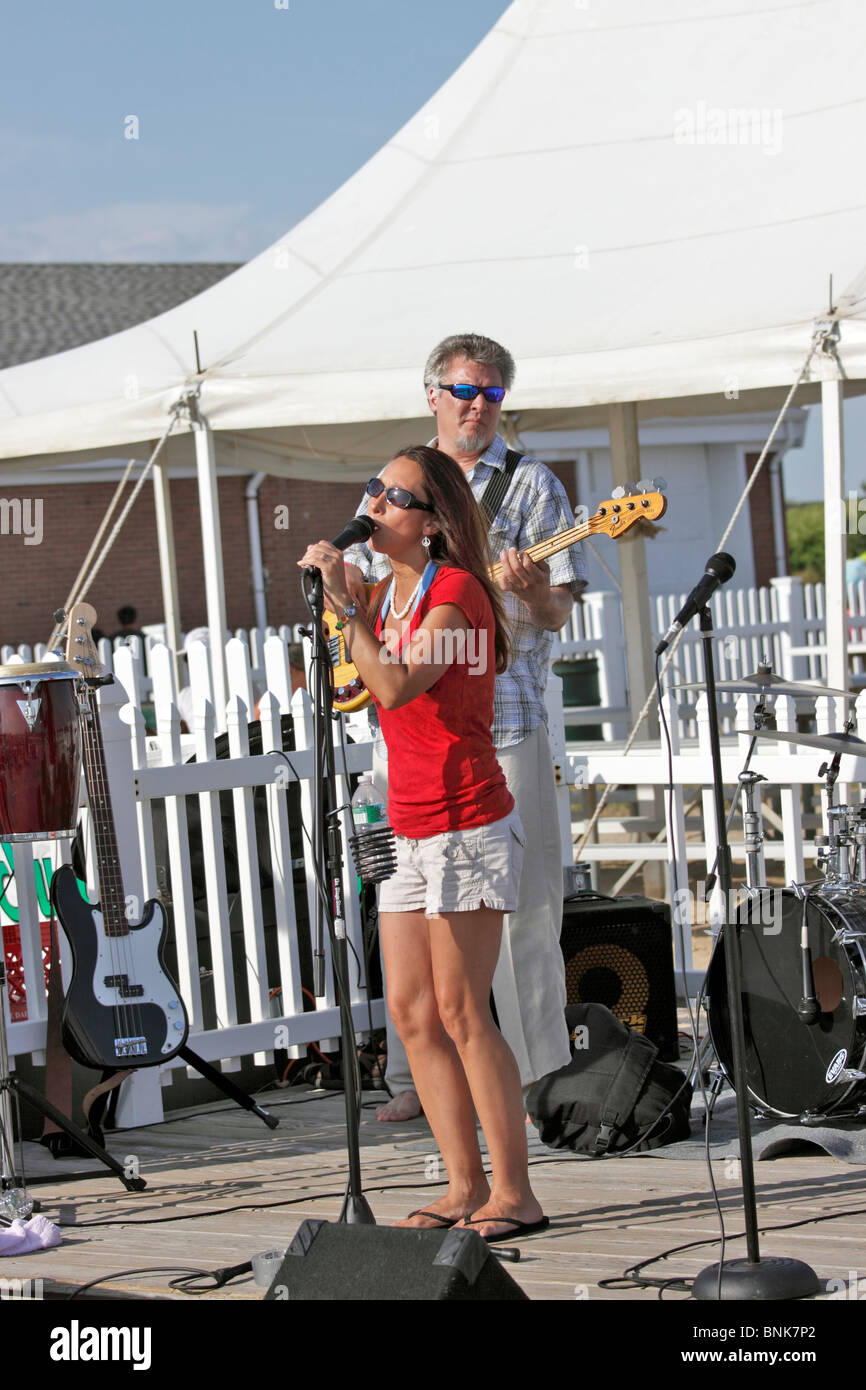 Band performing at outdoor restaurant Smith Point Beach Long Island NY Stock Photo