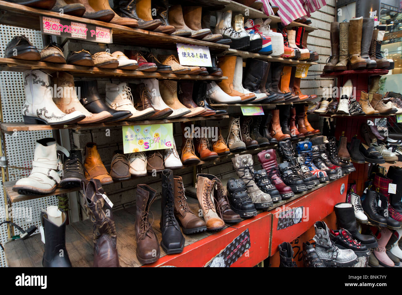 Leather boots on street stall in Shibuya, Tokyo, Japan Stock Photo Alamy