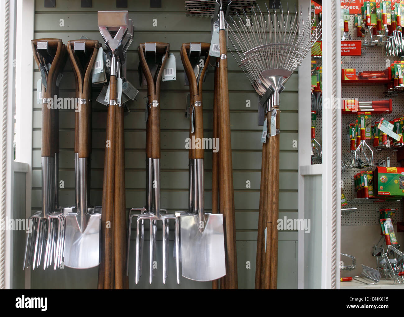 Quality garden tools, with stout wooden handles and metal tool ends on