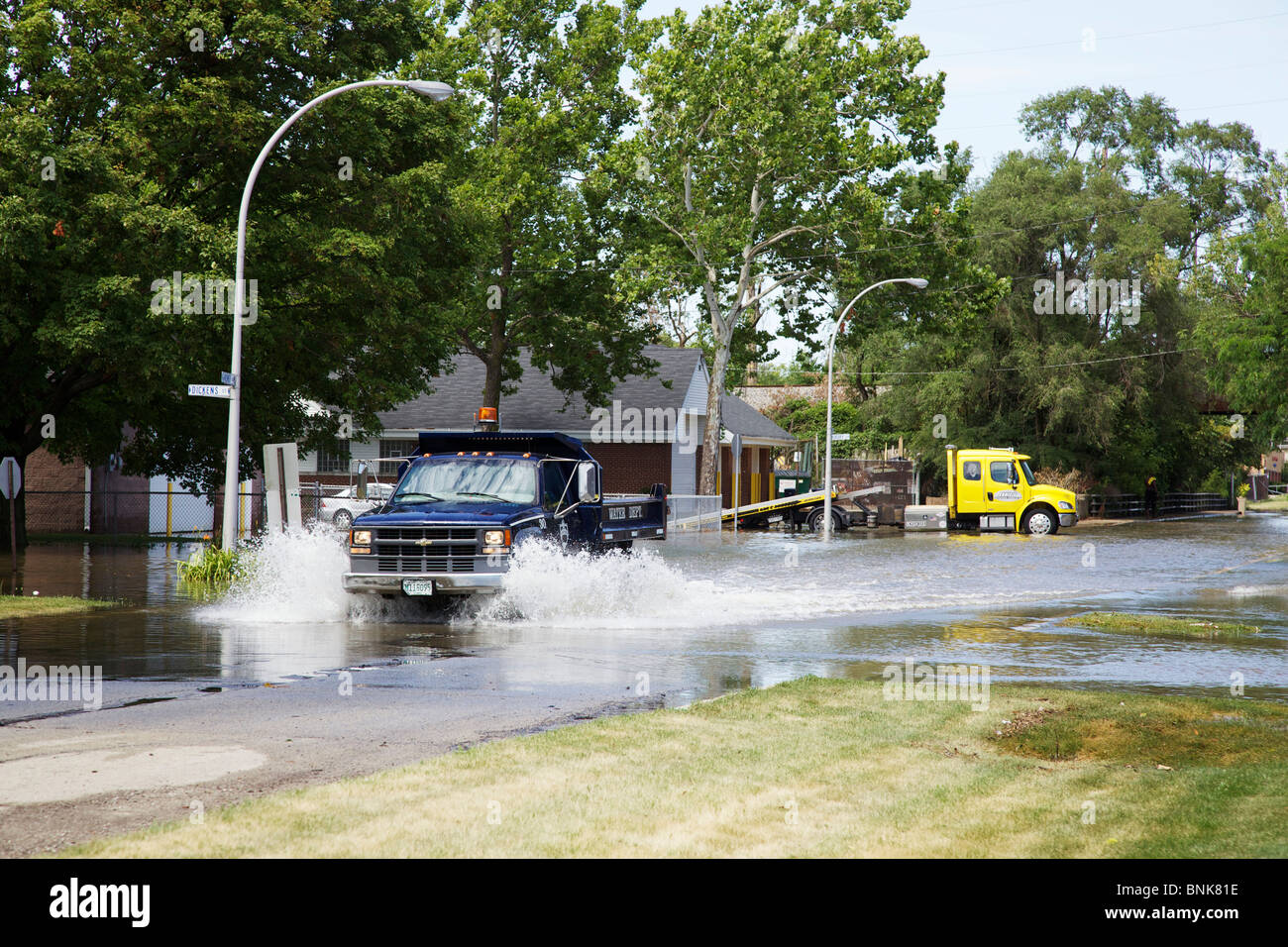 Water department truck driving through flooded street. Westchester
