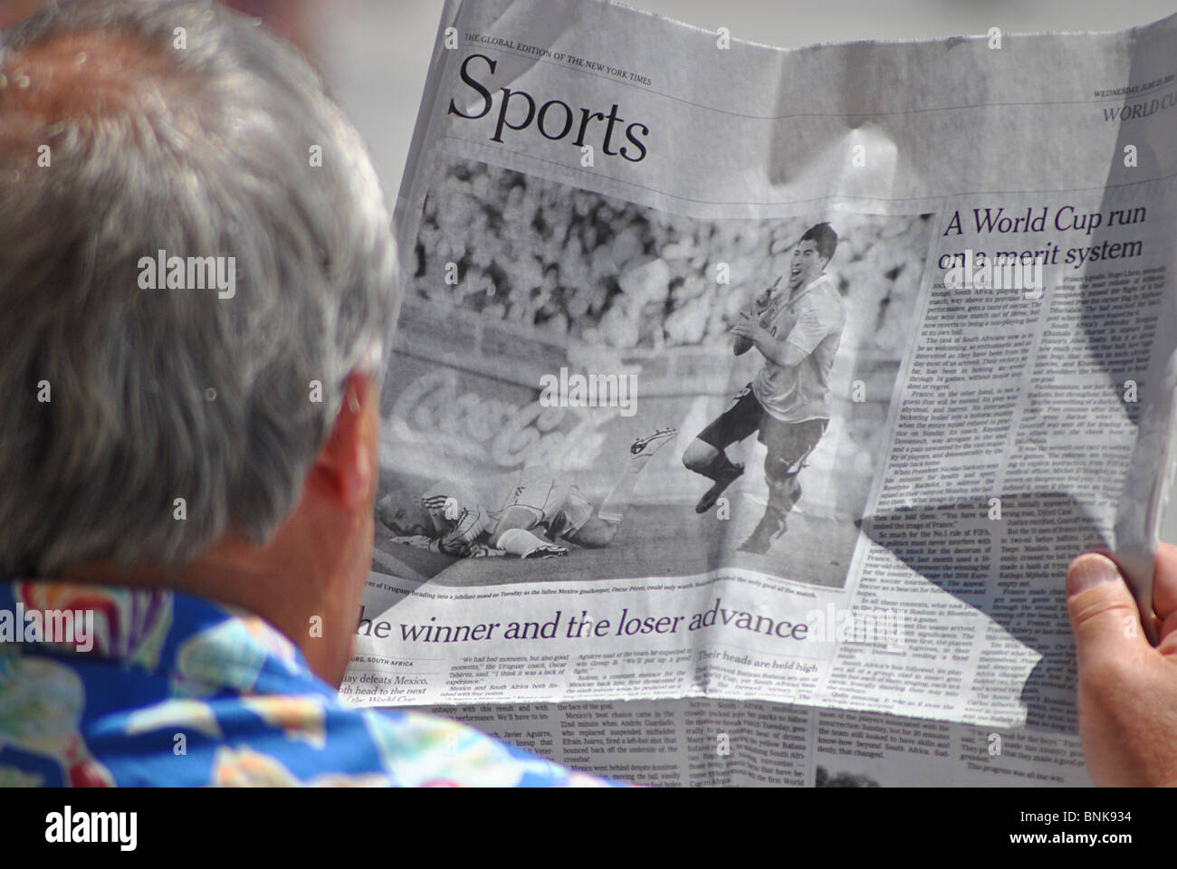 Man reading sport section of newspaper. Venice, italy Stock Photo