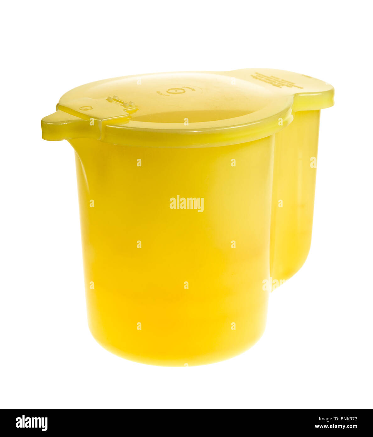 Classic Tupperware jug with lid and snap shut cover for pouring spout Stock Photo