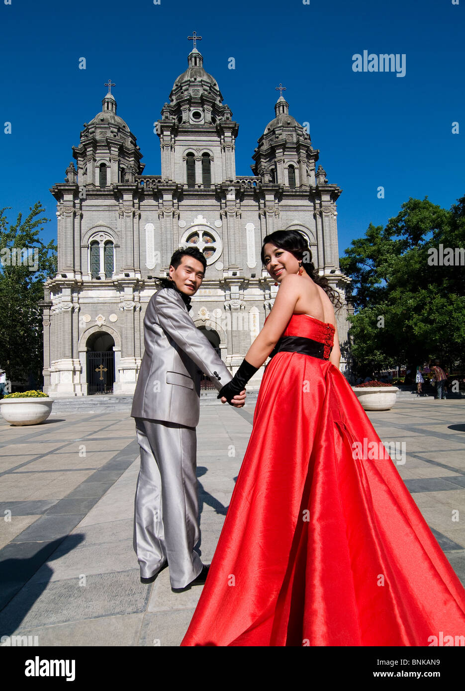 Chinese newly weds on their way to the church ( for a photo shoot ). Stock Photo