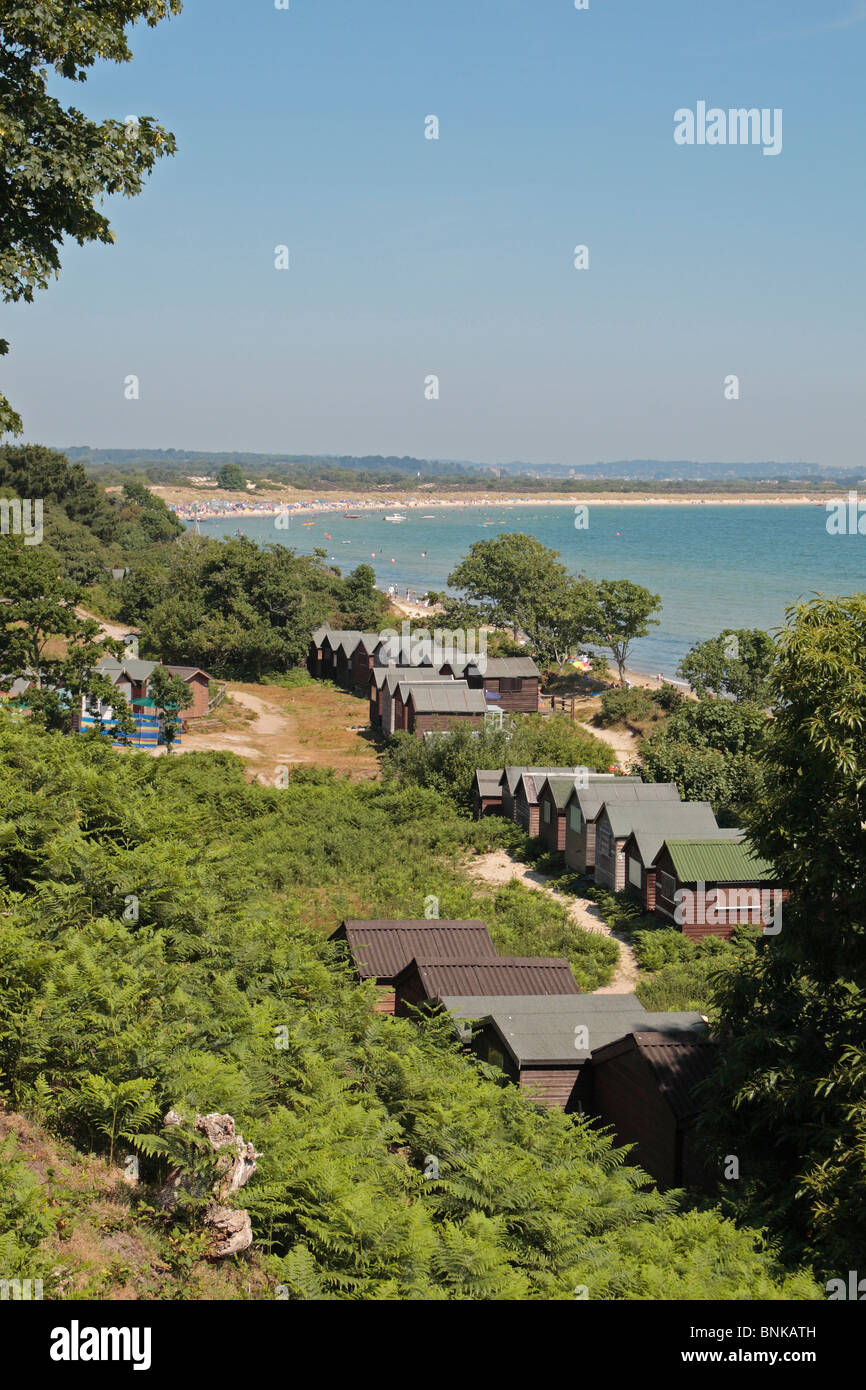A view over beach huts towards Studland beach and Studland Bay Dorset