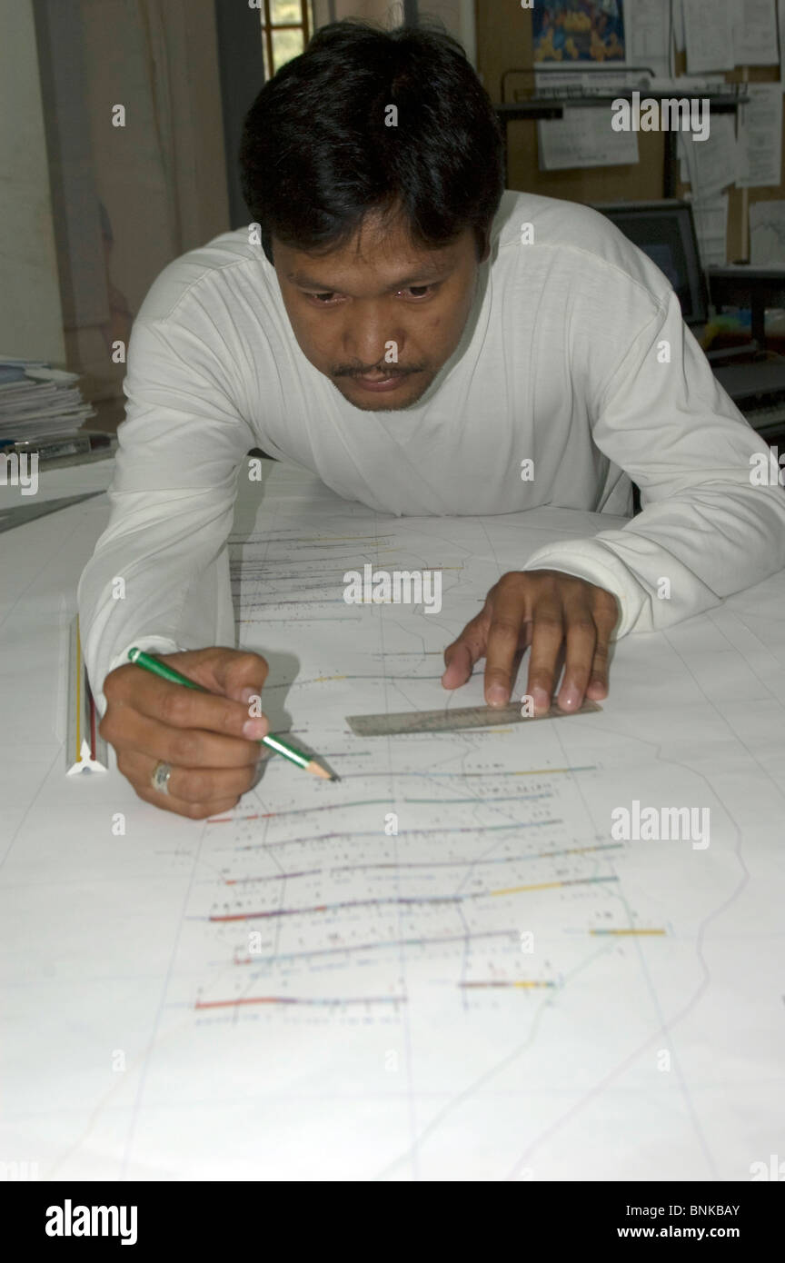 Filipino geologist plots the drilling sites at a copper mine in Tampakan South Cotobato Mindanao Philippines Stock Photo