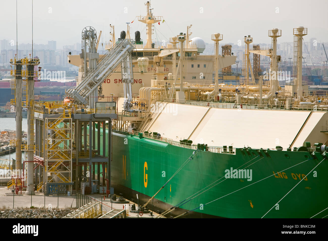 lng tanker oyo discharging liquefied natural gas cargo at Barcelona terminal Stock Photo